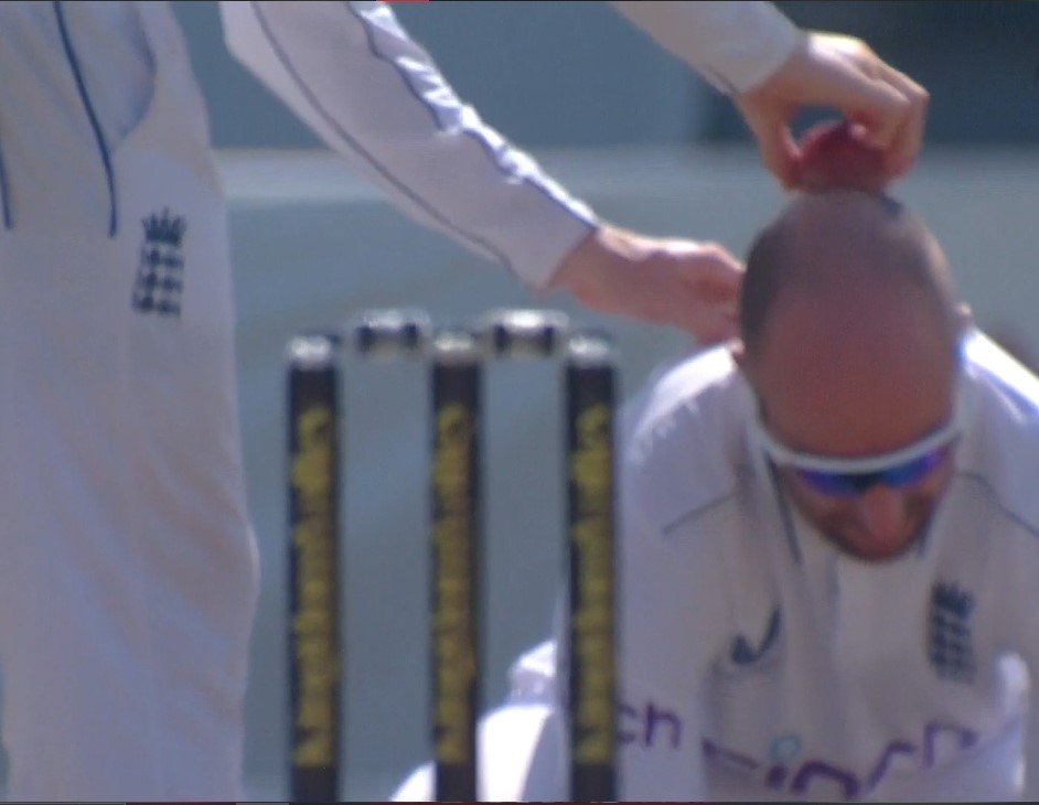 Shine on! Jack Root uses Leach’s head for ball polish!